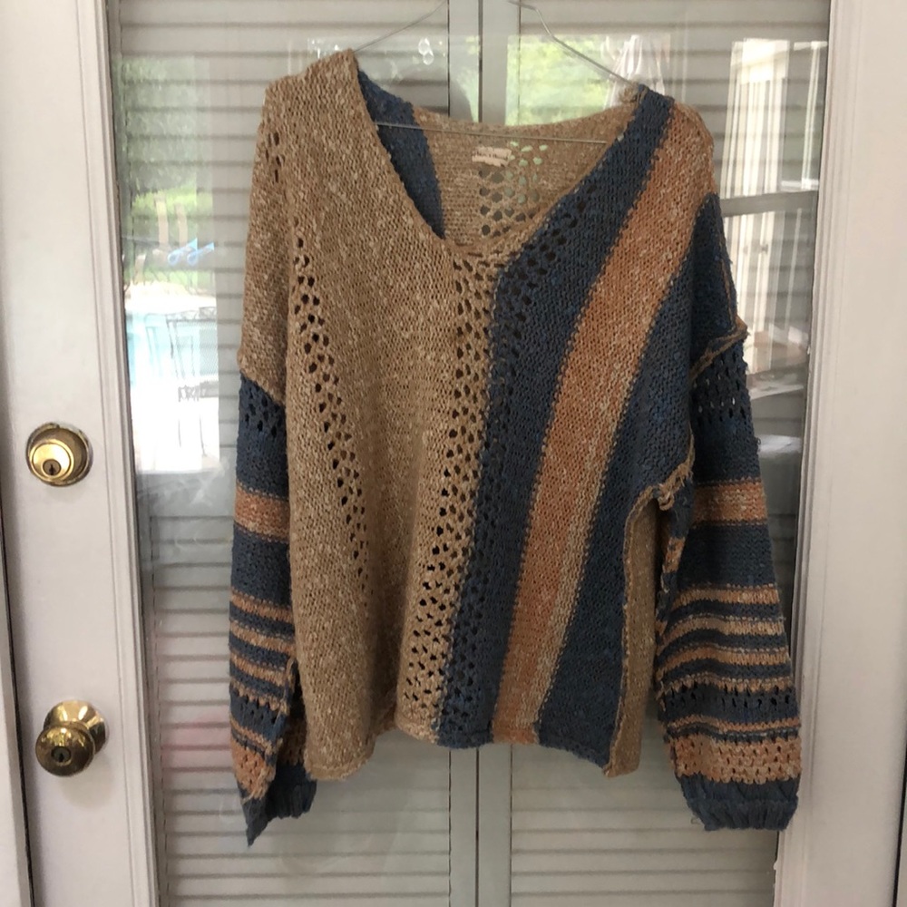 Orange tan and blue sweater